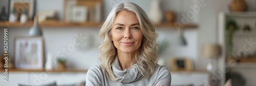 A cheerful senior woman with grey hair, smiling warmly, radiating happiness and health