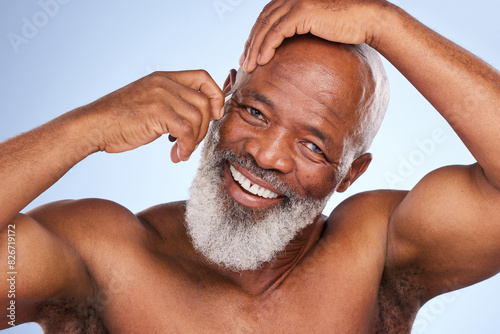 Black man, studio and eyebrow for hair removal, selfcare and grooming for epilation on blue background. Beauty, arms and hygiene for portrait of male person, cosmetic or smile for fresh skin and face photo