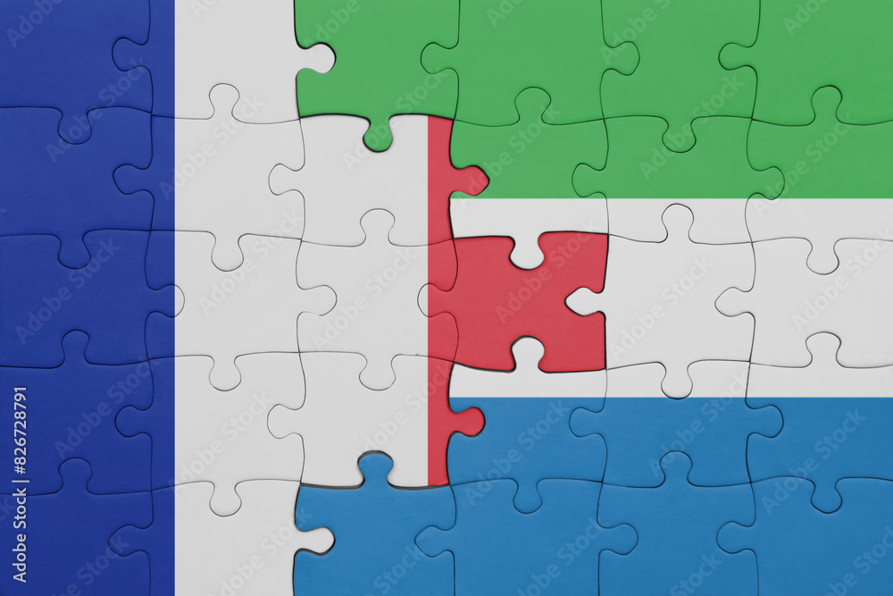 puzzle with the colourful national flag of sierra leone and flag of france. puzzle with the colourful national flag of sierra leone and flag of france.