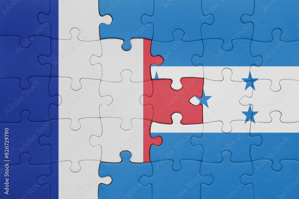 puzzle with the colourful national flag of honduras and flag of france. puzzle with the colourful national flag of honduras and flag of france.