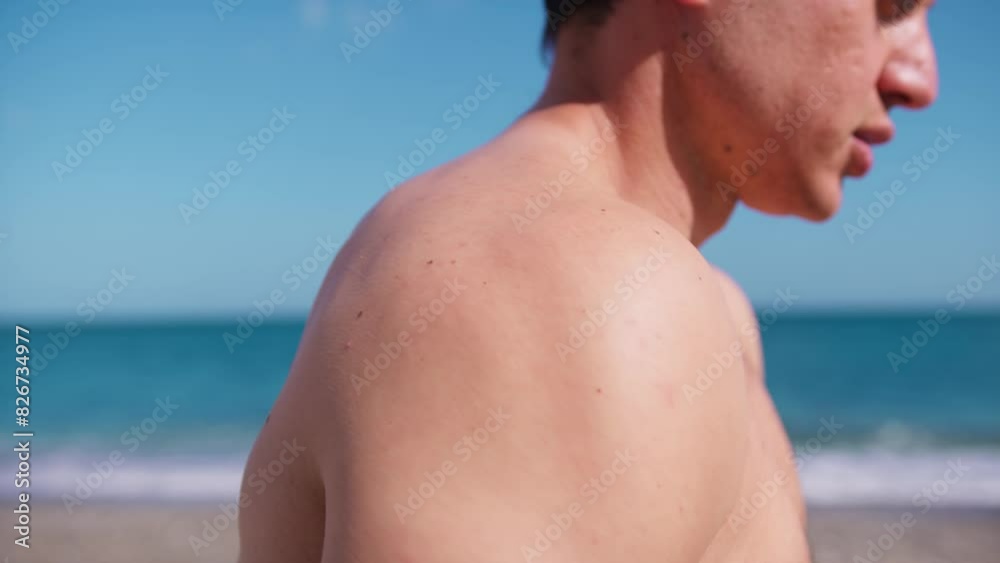 Right Deltoid Of A Boy Doing Exercises At The Seaside Right Deltoid Of A Boy Doing Exercises At The Seaside
