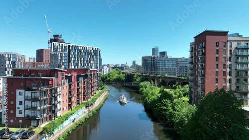 Travelling up the River Irwell in the city of Manchester in Northwest England photo