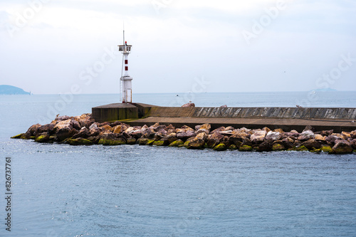 Lighthouse in the mediterranean sea photo