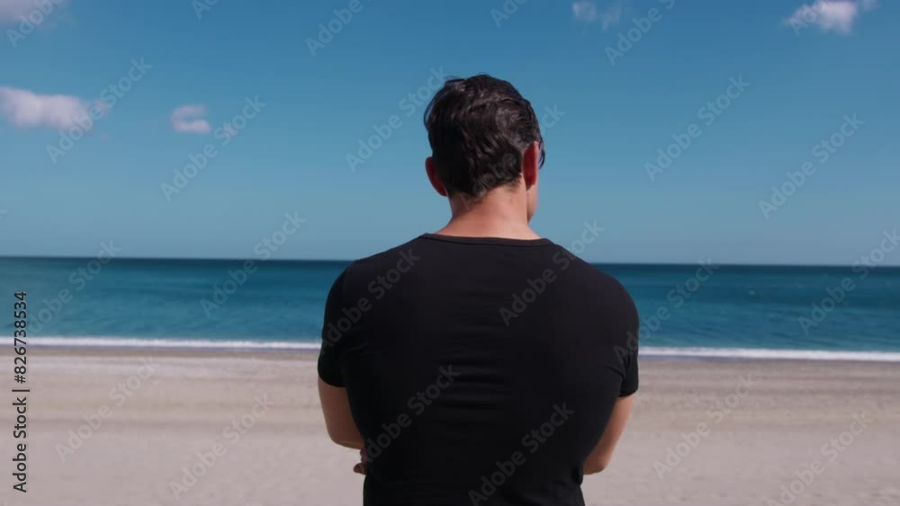 Boy Dressed In Black Observes The Sea On The Beach Boy Dressed In Black Observes The Sea On The Beach