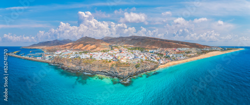 Landscape with Morro Jable in Fuerteventura, with azure waters and sandy shores offering a tranquil Canary Island escape.