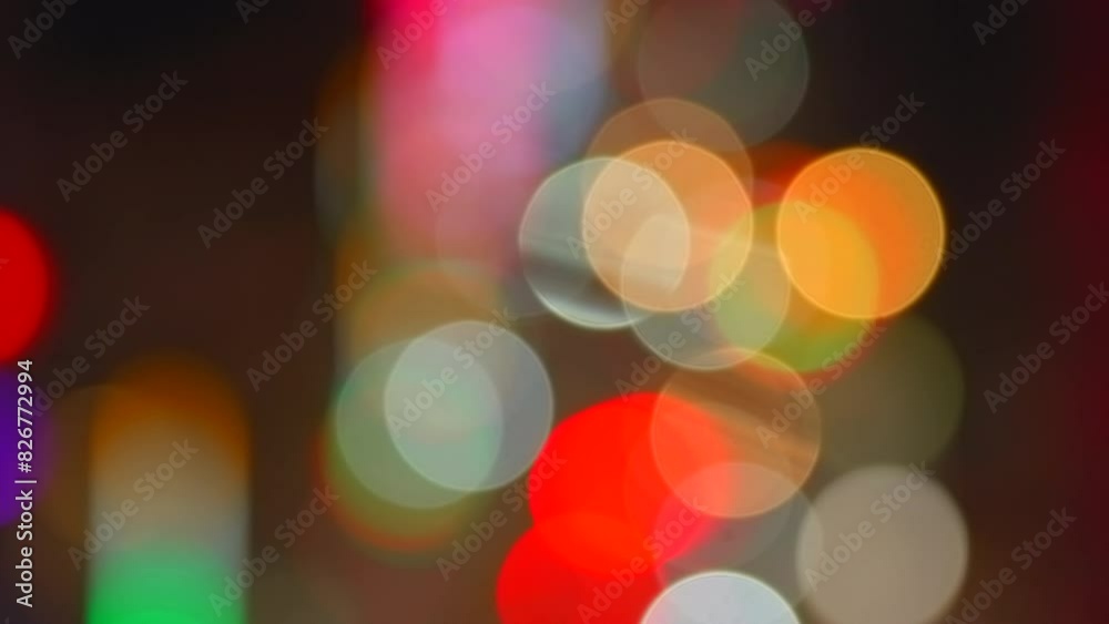Blurred night traffic car lights on busy street in New Delhi, India, abstract urban bokeh background, 4K.
