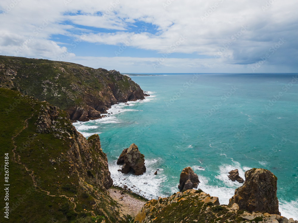 Famous tourist spot Cabo da Roca, is the westernmost cape of the Eurasian continent, located in Portugal. Drone aerial photo.