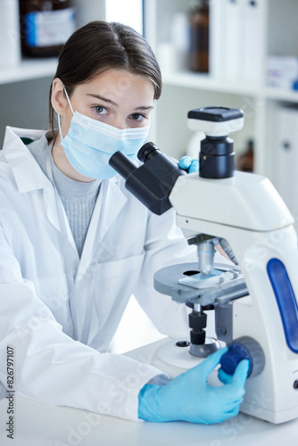 Laboratory, portrait and woman with microscope, mask and medical research in science. Vaccine innovation, scientist or lab technician for healthcare, medicine and pharmaceutical development with ppe.