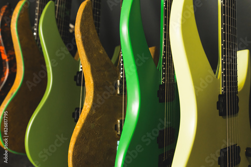 closeup of green and yellow guitars in the studio, a collection of electric guitars at the recording studio. High quality photo