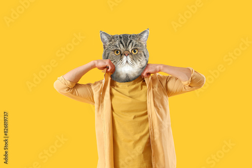Young man in shirt on yello...
