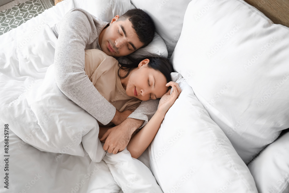 Young couple sleeping in bedroom Young couple sleeping in bedroom