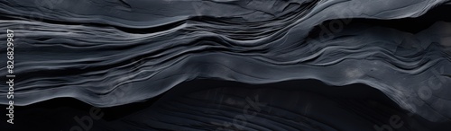 Obsidian. Black lava texture background. Obsidian texture. cut and polished obsidian. raw obsidian © John Martin