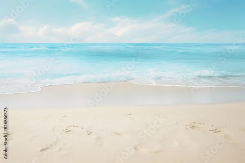 Pristine sandy beach with gentle turquoise waves and a bright blue sky  creating a tranquil and inviting coastal scene