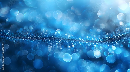 Abstract blue bokeh lights with glitter on a dark background. Festive and celebratory concept for design and print.