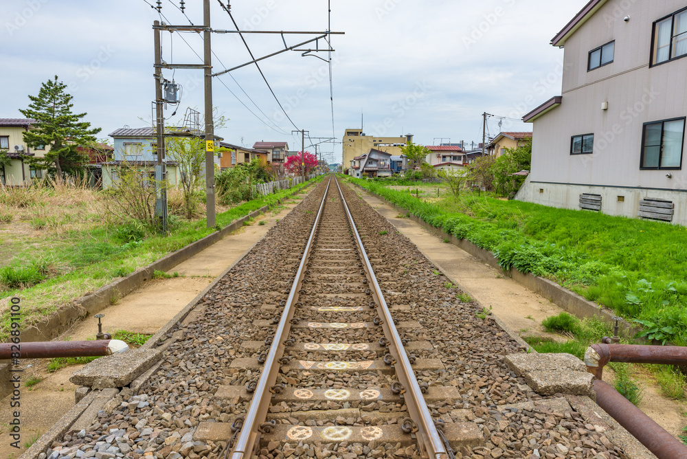 Long straight rail track, single-track railway, Echigo Tokimeki Railway, Japan Long straight rail track, single-track railway, Echigo Tokimeki Railway, Japan