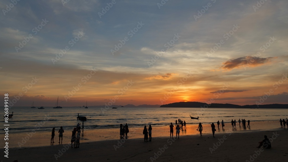 sunset at the beach with people