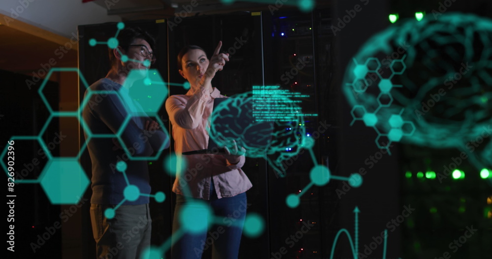 Obraz premium Image of medical data processing over diverse male female engineers discussing at server room