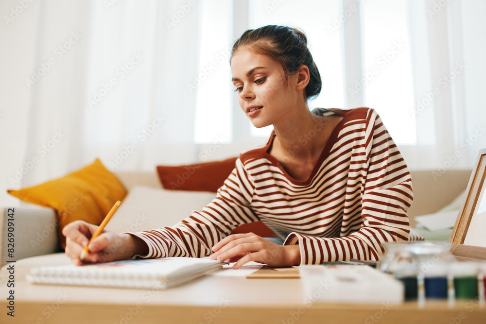 Happy Teenage Girl Painting a Cute Portrait at Home - Indoor Art Studio Happy Teenage Girl Painting a Cute Portrait at Home - Indoor Art Studio
