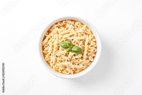 Top View of a Bowl of Pasta Soup with Basil