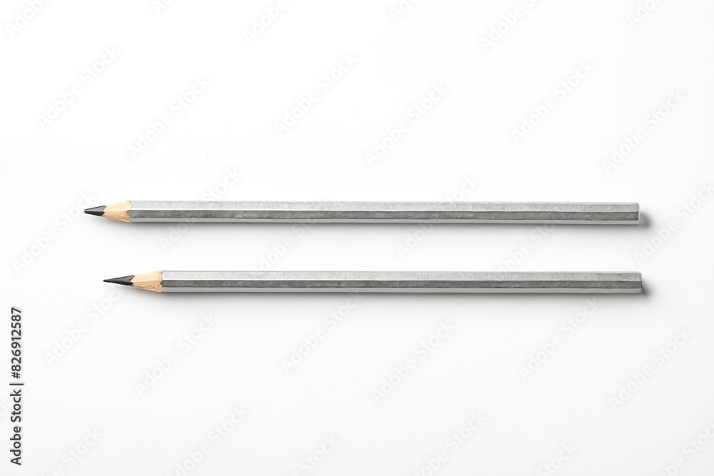 Two Silver Pencils on White Background Two Silver Pencils on White Background
