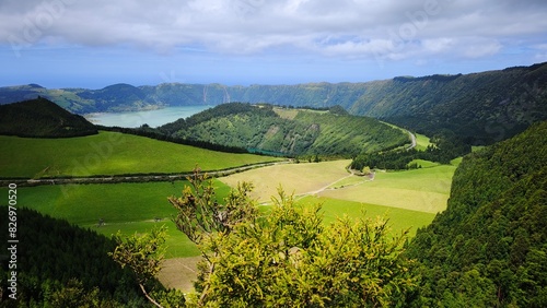 kes in a volcanic crater, green meadows and forests, fantastic natural scenery. The Azores. photo