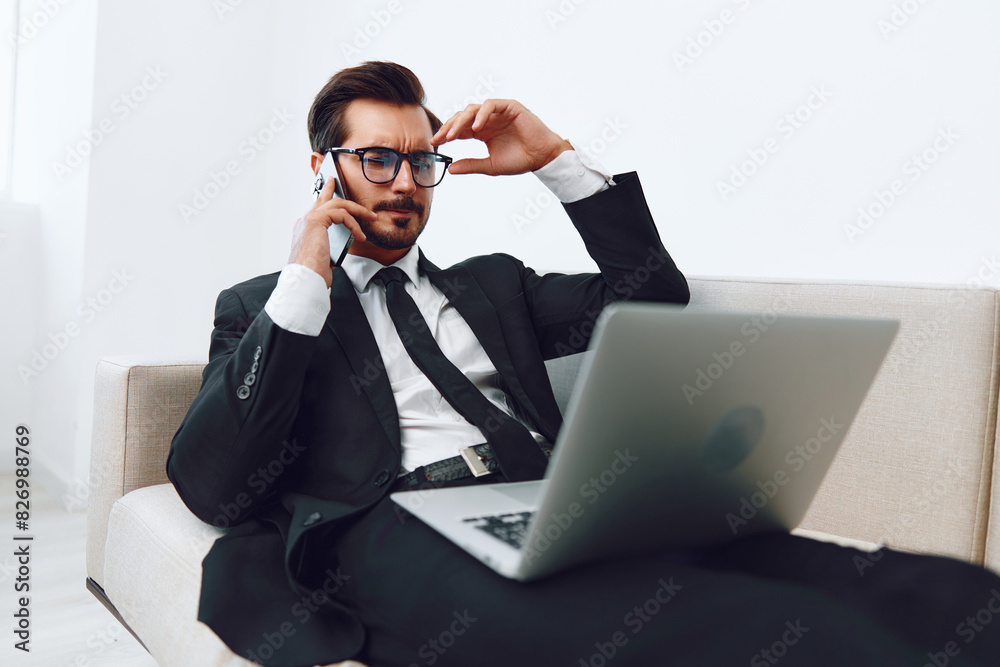 Man smile conversation caucasian call phone laptop video office phone computer mobile businessman winner couch talk Man smile conversation caucasian call phone laptop video office phone computer mobile businessman winner couch talk