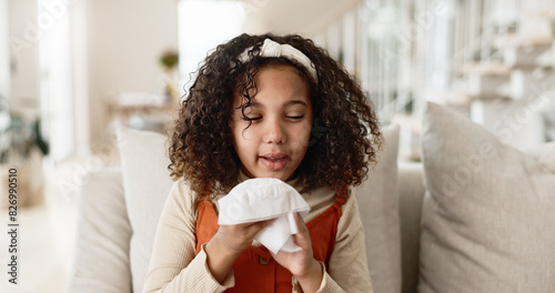 Cuadro en lienzo Little girl, sofa and blowing nose with tissue for virus, infection or sneeze in living room at home