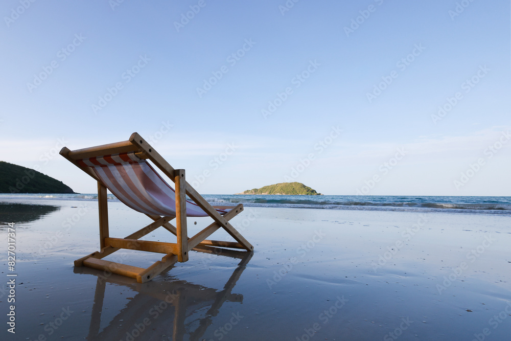 Wooden lounge chairs on a beautiful tropical beach Wooden lounge chairs on a beautiful tropical beach