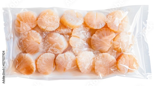 Frozen scallops preserved in a vacuum sealed plastic bag against a white background with a clipping path included