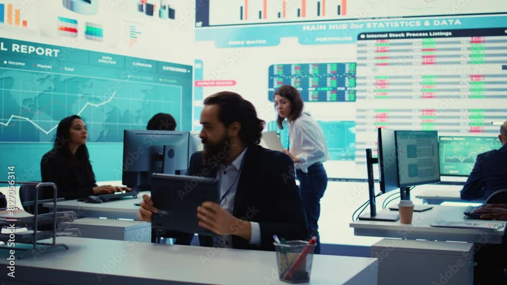Angry displeased team leader failing to accomplish enterprise goals, leaving the business monitoring room to cool off and calm down. Displeased supervisor is mad and takes a break. Camera B.