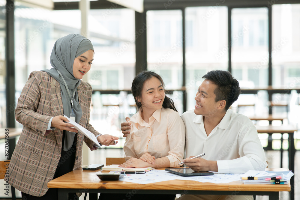 Asian businessmen, women and men Talk about new projects, presents at home office.