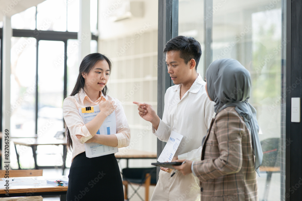 Asian businessmen, women and men Talk about new projects, presents at home office.