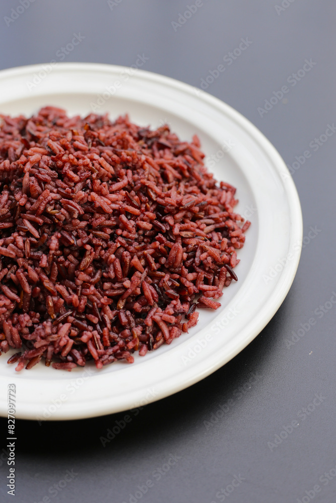 Cooked black berry rice on dark background. Cooked black berry rice on dark background.