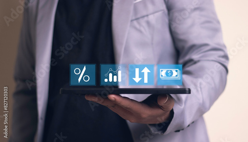 mortgage rates Businessman touches interest rate icon on virtual screen Calculate variable interest rates according to standard criteria.