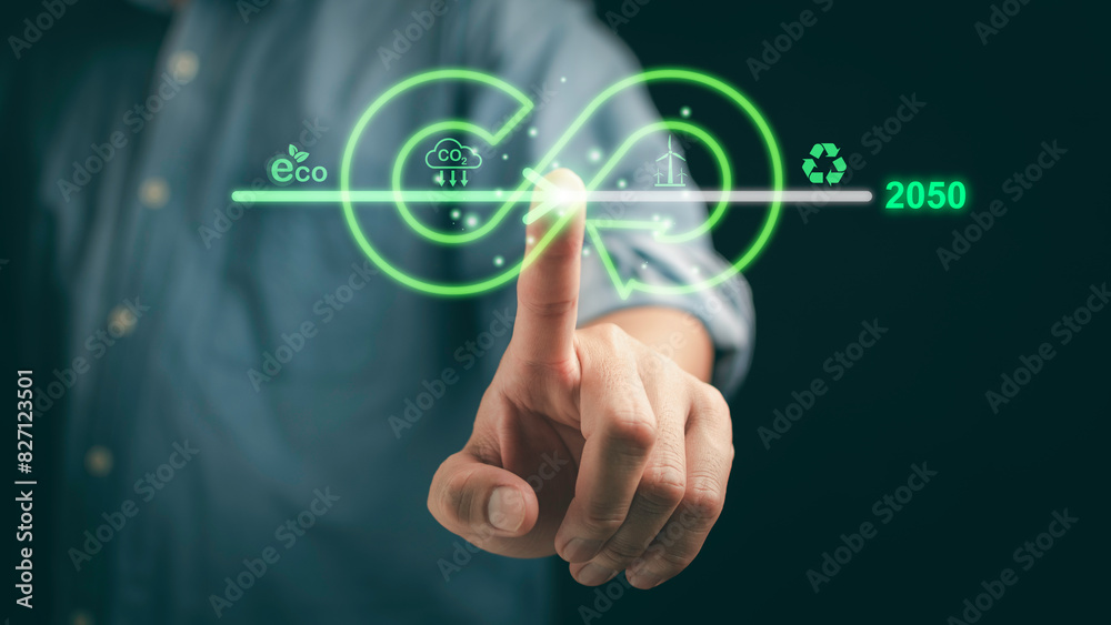 Businessman pointing towards an upward arrow, symbolizing the rise in carbon reduction efforts to combat climate change, emphasizing a sustainable, green economy. Businessman pointing towards an upward arrow, symbolizing the rise in carbon reduction efforts to combat climate change, emphasizing a sustainable, green economy.