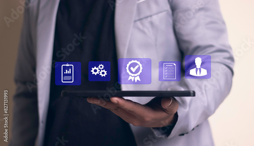 Quality assurance concept. Businessman touching Quality assurance icon on digital screen for ISO certification and standardization. certificate, approval, compliance to requirements