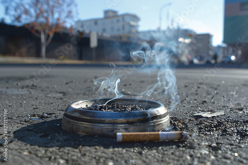 a cigarette in a ashtray photo