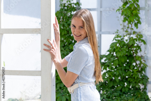 Portrait of a beautiful young woman in a blue dress in the park Free Download Portrait of a beautiful young woman in a blue dress in the park - GFXLoad