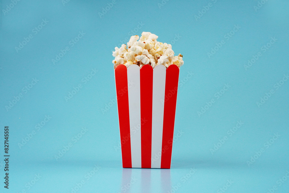 red and white strip box full of popcorn background concept
