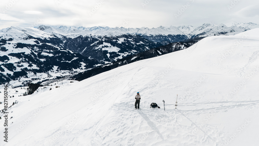 Drone pilot in snowy mountains of Kitzbühel, Tyrol, Austria Drone pilot in snowy mountains of Kitzbühel, Tyrol, Austria