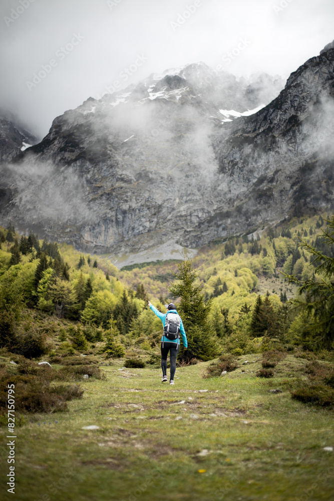 Hiker pointing to Wilder Kaiser mountains in Kitzbühel, Tyrol Hiker pointing to Wilder Kaiser mountains in Kitzbühel, Tyrol