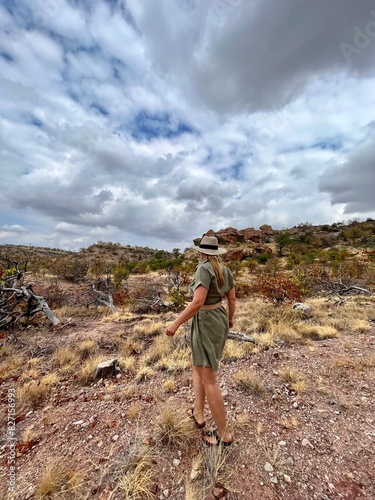 Woman in a medium long safari dress walking in mountains in Southern Africa 