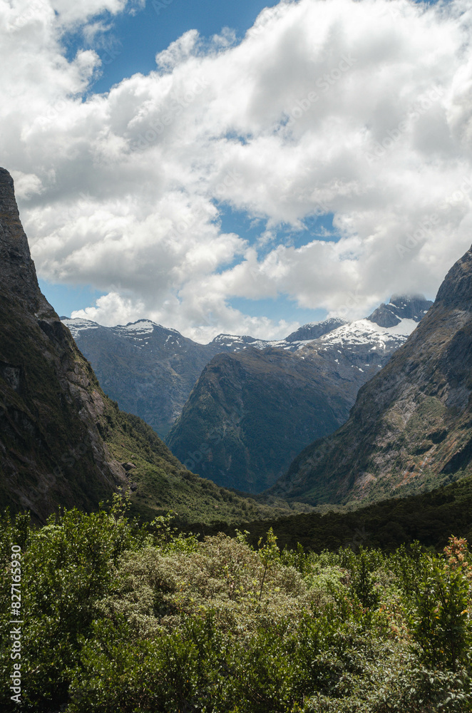 Fototapeta premium landscape with sky, clouds and a backdrop of snowy peaks, New Zealand
