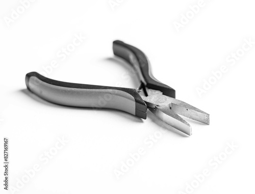 Pliers tool and metal equipment, handle steel white background work object. Industrial repair instrument, workshop cut iron construction. Yellow fix craft hand tongs,