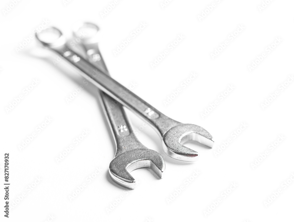 Wrench and spanner equipment, metallic tools for industrial repair. Mechanical steel work construction service chrome workshop fix plumber. Object shiny iron background