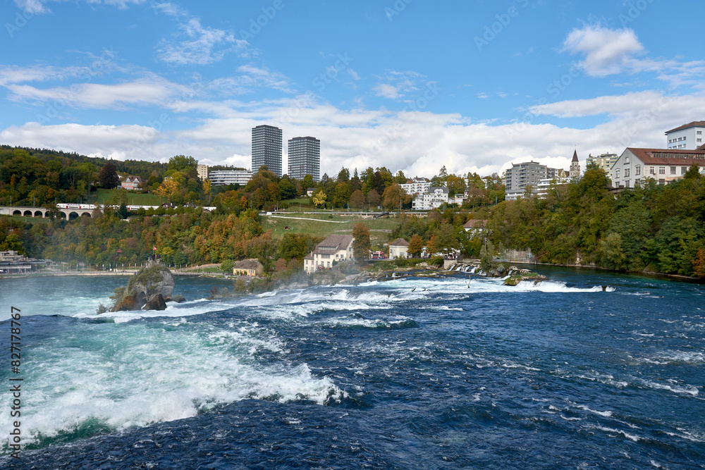 Powerful white rapids of the Rhine River at the Rhine Falls, the famous and largest waterfall in Europe located in Schaffhausen, Switzerland Powerful white rapids of the Rhine River at the Rhine Falls, the famous and largest waterfall in Europe located in Schaffhausen, Switzerland