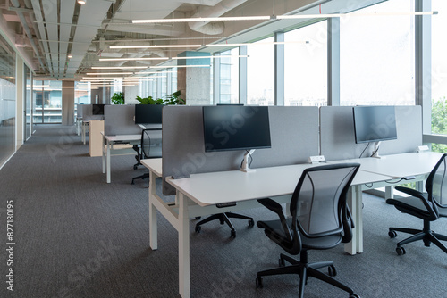 Interior of modern empty office building.Open ceiling design.Equipped with automatic lifting table and LCD screen.