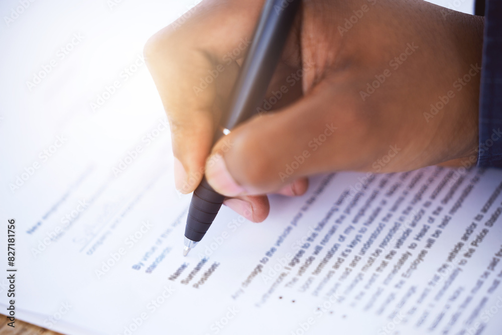 Contract, hand and pen with employee for application, agreement and signing paperwork. Document, person and writing form for recruitment or hiring, signature approval or office and paper on table Contract, hand and pen with employee for application, agreement and signing paperwork. Document, person and writing form for recruitment or hiring, signature approval or office and paper on table