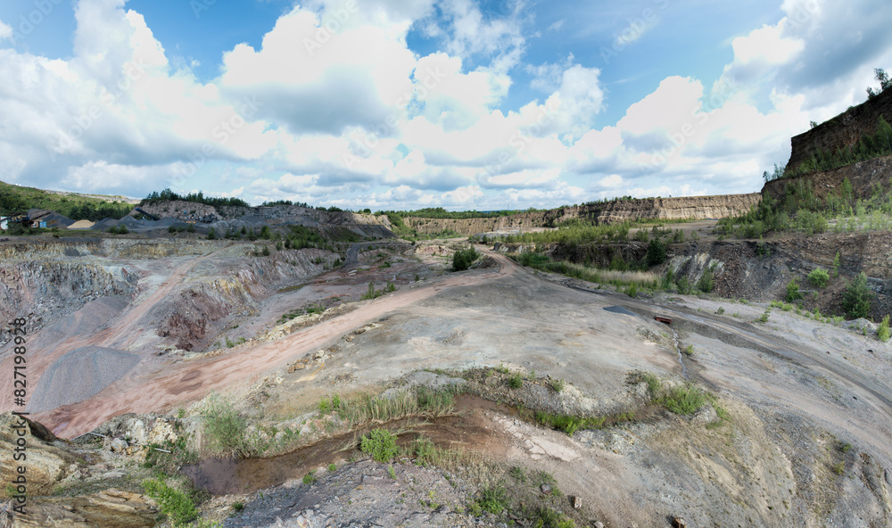 Obraz premium Open-pit mining sounds like a giant sandbox for adults, doesn't it? Imagine huge machines that look like oversized toy excavators
