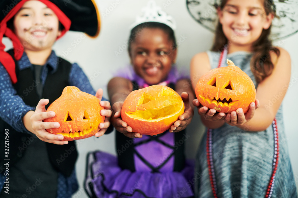 Halloween, pumpkin and kids in studio with costume for fantasy, birthday party and happiness. Orange vegetable, jack o lantern and young children with creative fashion and smile by white background